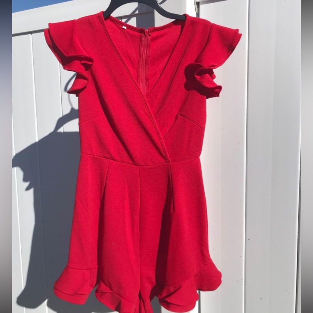 Brand New! Size small red ruffle romper..